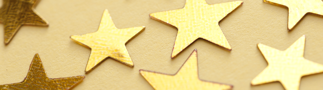 Gold stars on a pale yellow background