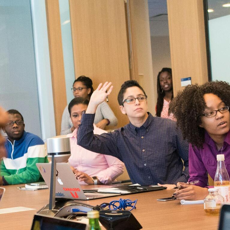 Group of professional at a meeting engaging in conversation 