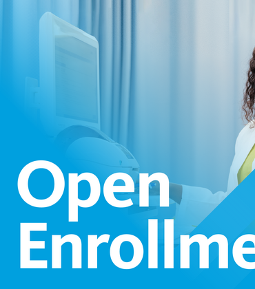 An African American woman dressed in a lab coat on an open enrollment banner for UC