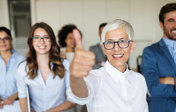 employees giving thumbs up