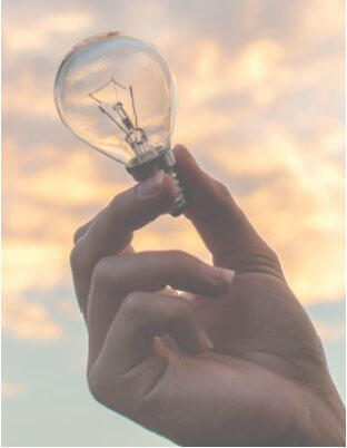 lightbulb in someones hand