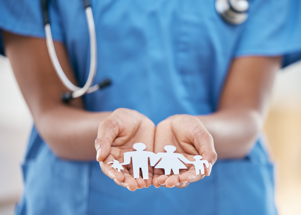 Family nurse, doctor and woman hands with paper dolls to show children healthcare support. Hospital
